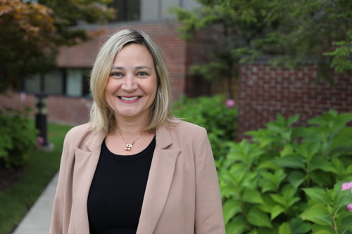 Andrea Bibby outside of Planning, Building, and Ordinance offices at Township Hall