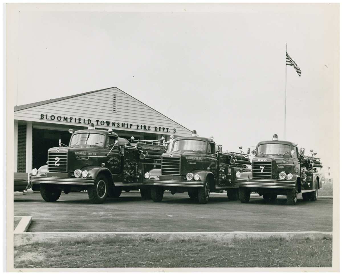 Historical photo of Bloomfield Township Fire Dept with 3 fire trucks parked in front